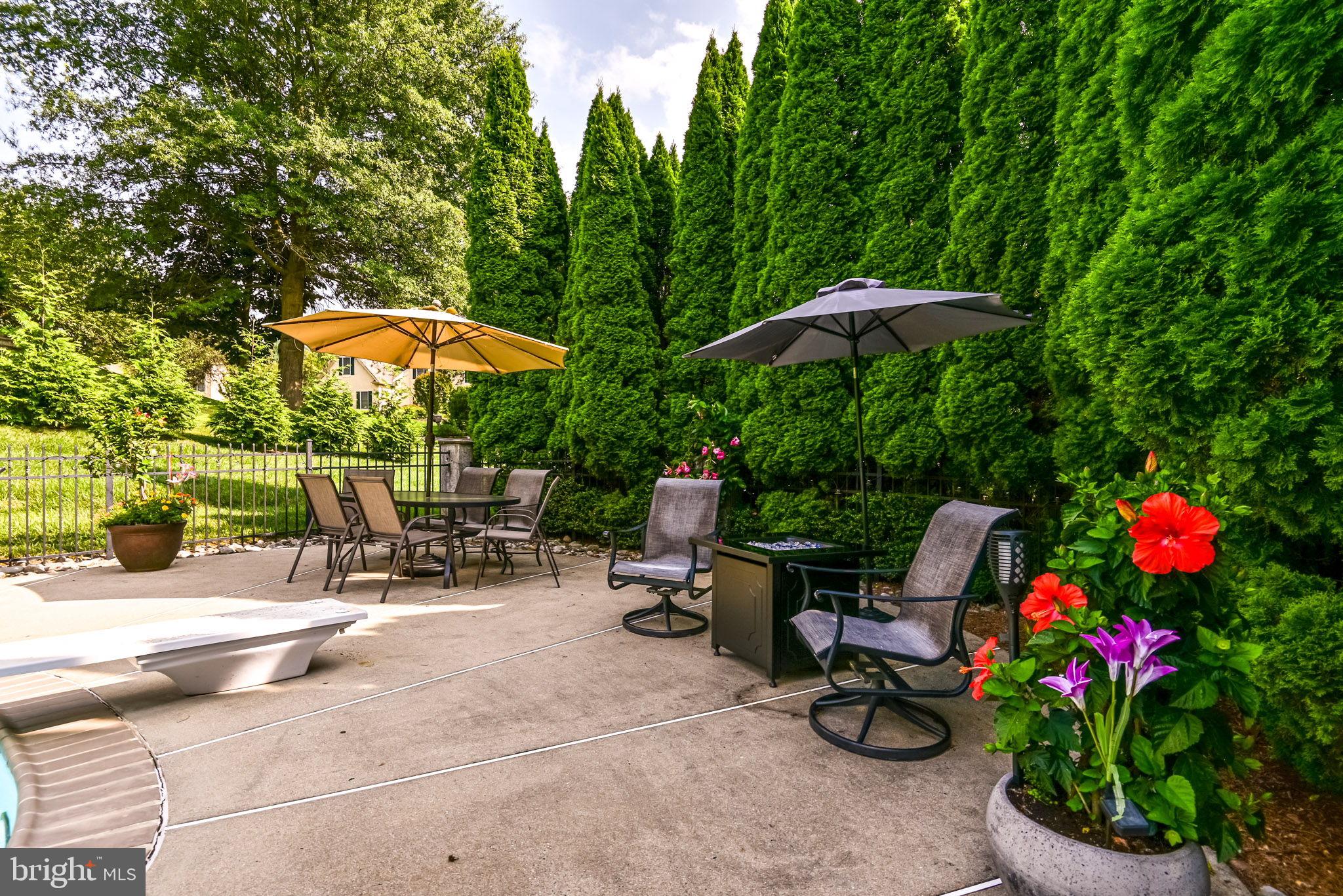 706 Regency Hill Road Hockessin, DE 19707 - Photo 44 of 54 an outdoor space with patio and white umbrellas
