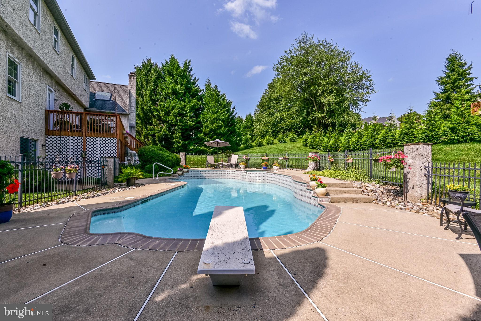 706 Regency Hill Road Hockessin, DE 19707 - Photo 45 of 54 a view of a swimming pool with a patio