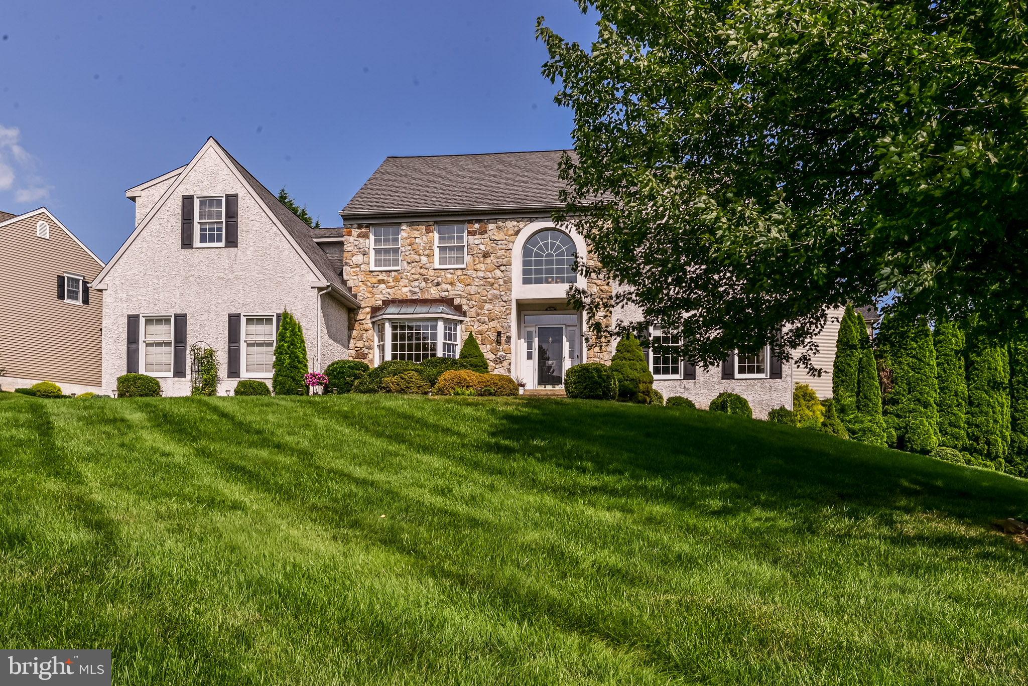 706 Regency Hill Road Hockessin, DE 19707 - Photo 53 of 54 a front view of a house with a yard