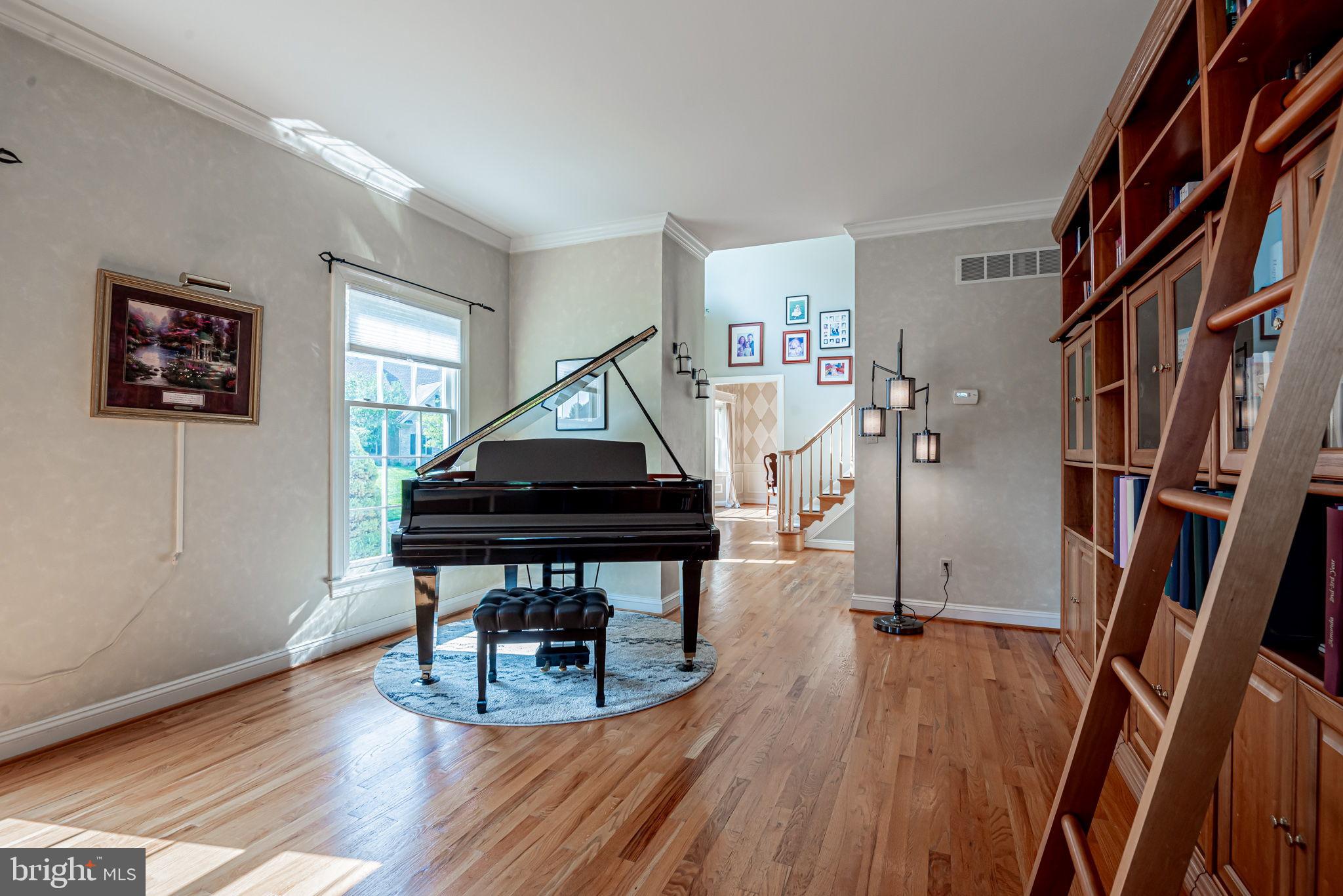 706 Regency Hill Road Hockessin, DE 19707 - Photo 8 of 54 a room with furniture and wooden floor