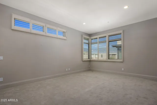 a bathroom with a shower sink vanity and toilet