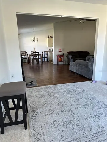 a view of a livingroom with furniture and workspace