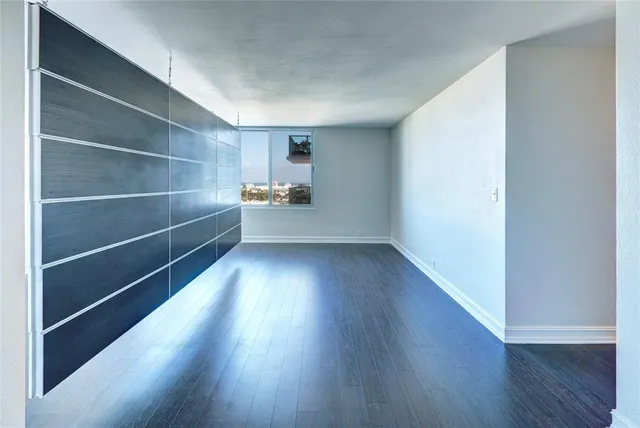 a view of an empty room with a chandelier