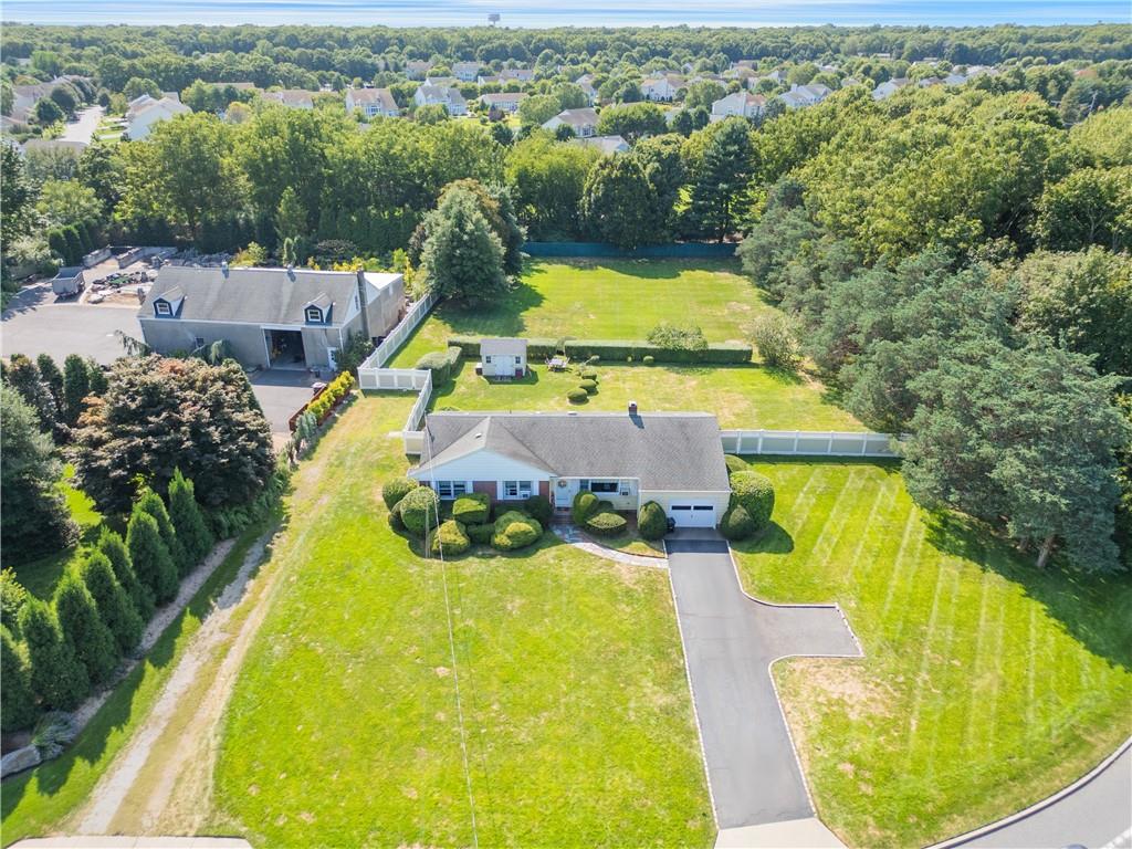 202 Moriches Road St. James, NY 11780 - Photo 1 of 1 an aerial view of residential houses with outdoor space and swimming pool