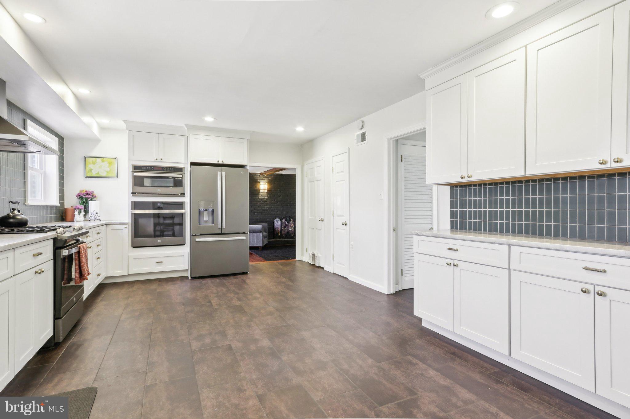 2305 Huntingdon Road Huntingdon Valley, PA 19006 - Photo 11 of 57 a kitchen with stainless steel appliances a refrigerator and a stove top oven