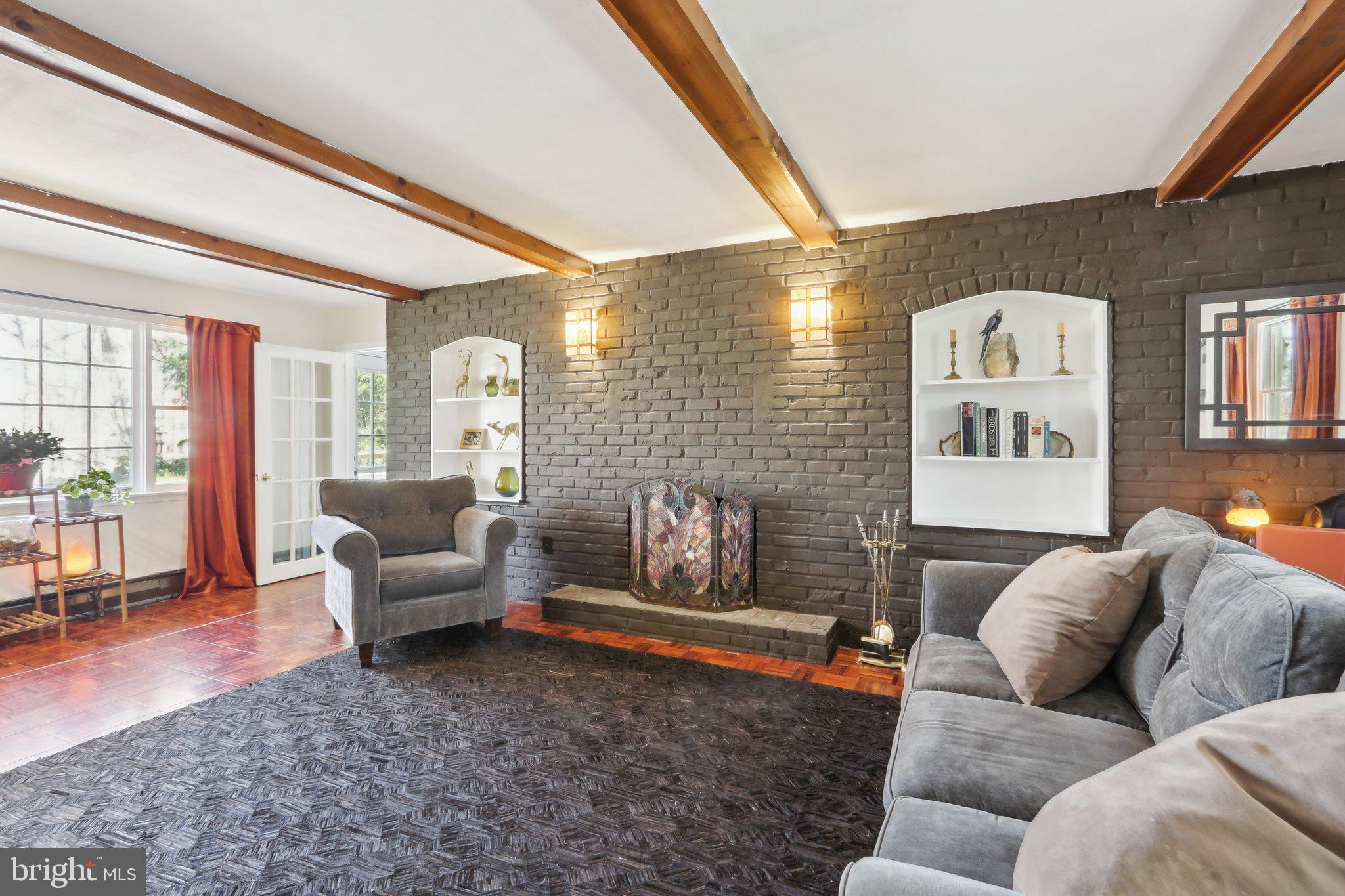 2305 Huntingdon Road Huntingdon Valley, PA 19006 - Photo 14 of 57 a living room with furniture and a fireplace