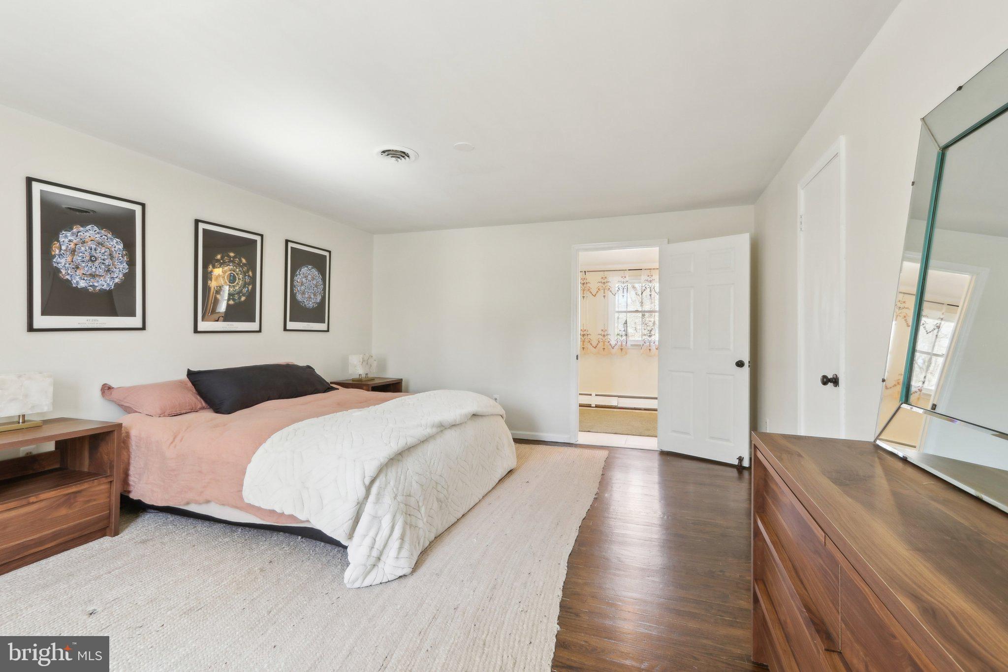 2305 Huntingdon Road Huntingdon Valley, PA 19006 - Photo 23 of 57 a spacious bedroom with a bed and a large window