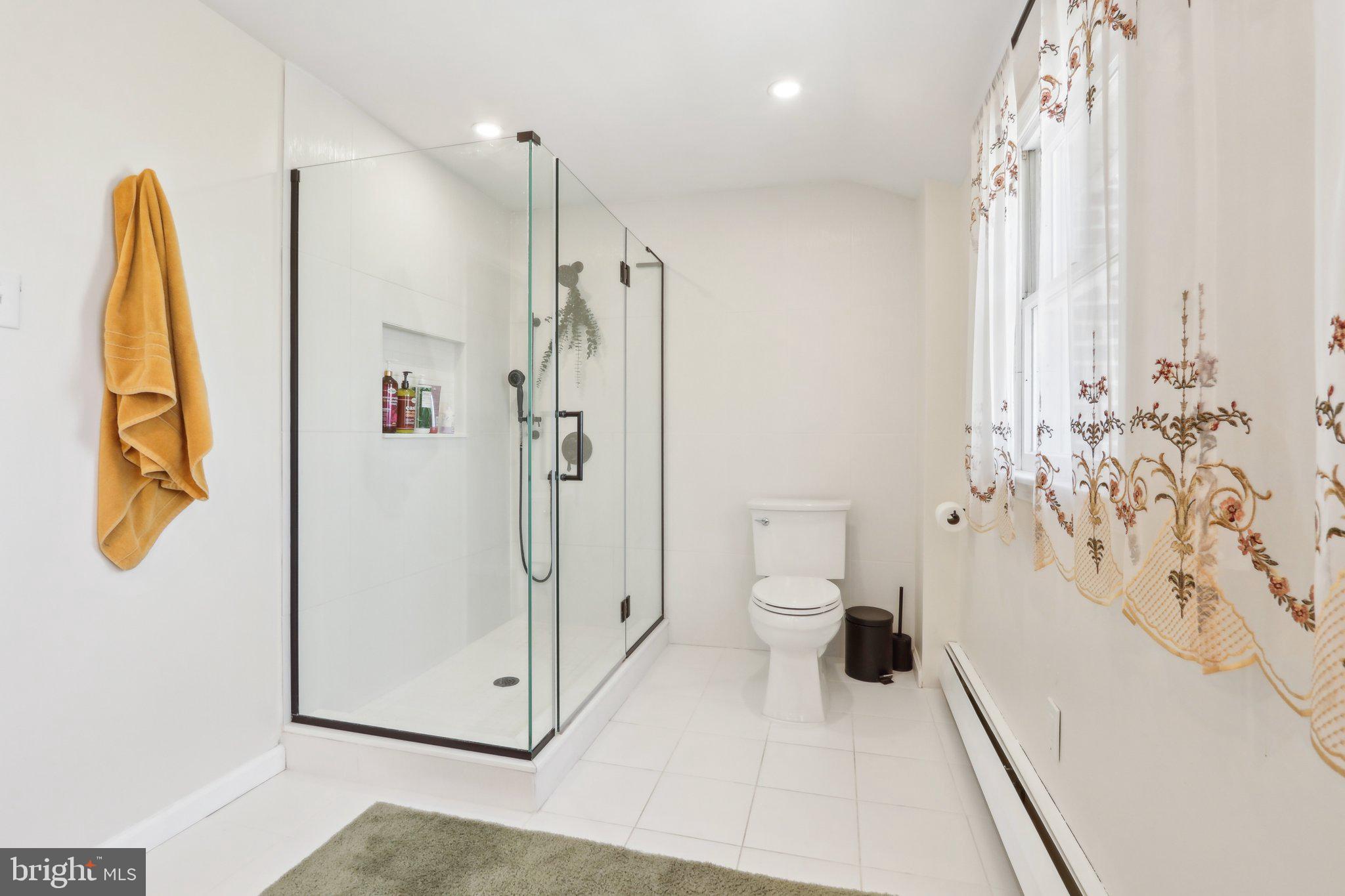 2305 Huntingdon Road Huntingdon Valley, PA 19006 - Photo 24 of 57 a bathroom with a granite countertop sink a toilet and shower
