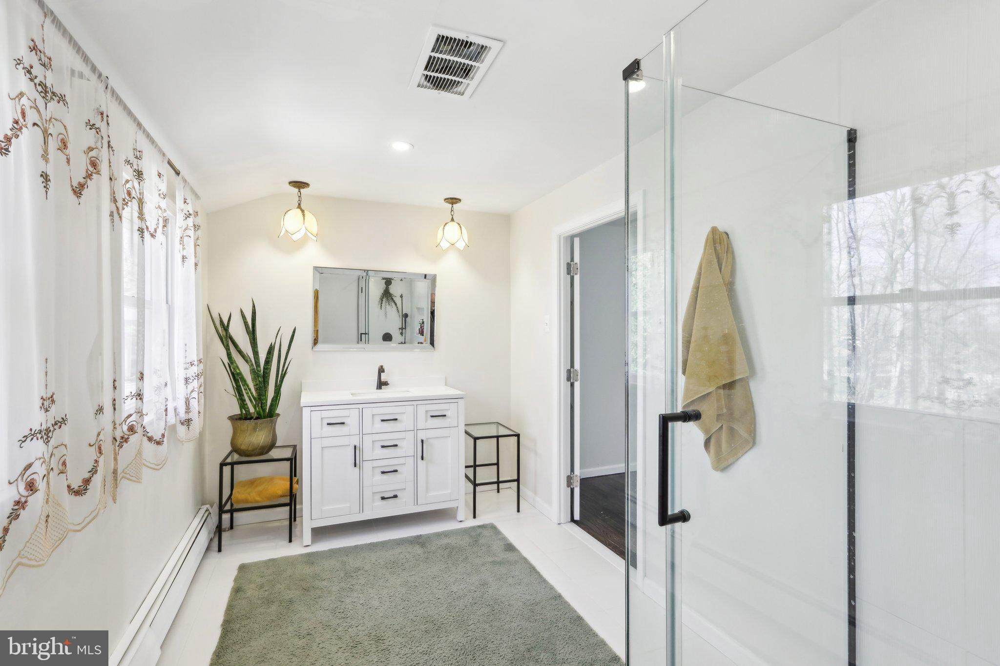 2305 Huntingdon Road Huntingdon Valley, PA 19006 - Photo 25 of 57 a spacious bathroom with a double vanity sink shower and a mirror