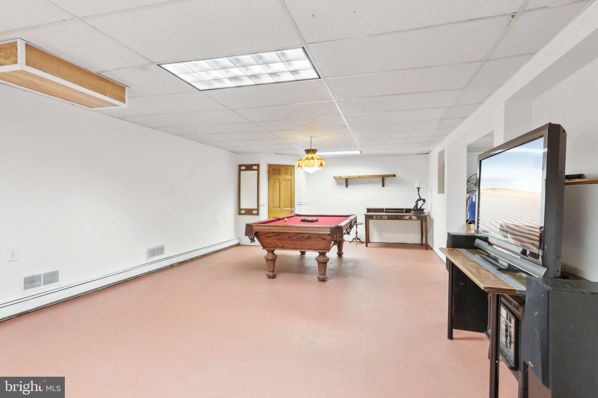2305 Huntingdon Road Huntingdon Valley, PA 19006 - Photo 36 of 57 a view of a livingroom with furniture and a flat screen tv