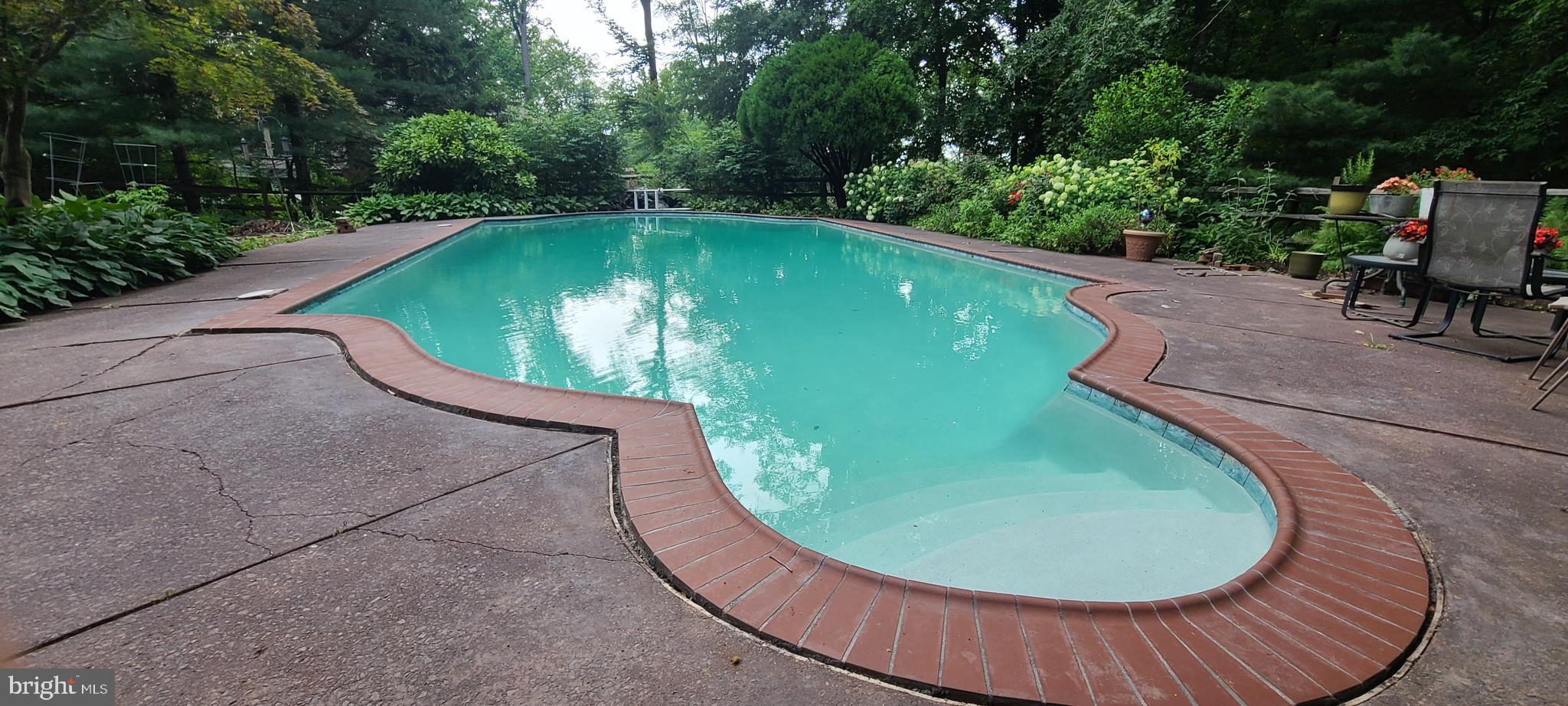 2305 Huntingdon Road Huntingdon Valley, PA 19006 - Photo 45 of 57 a view of a swimming pool with a garden