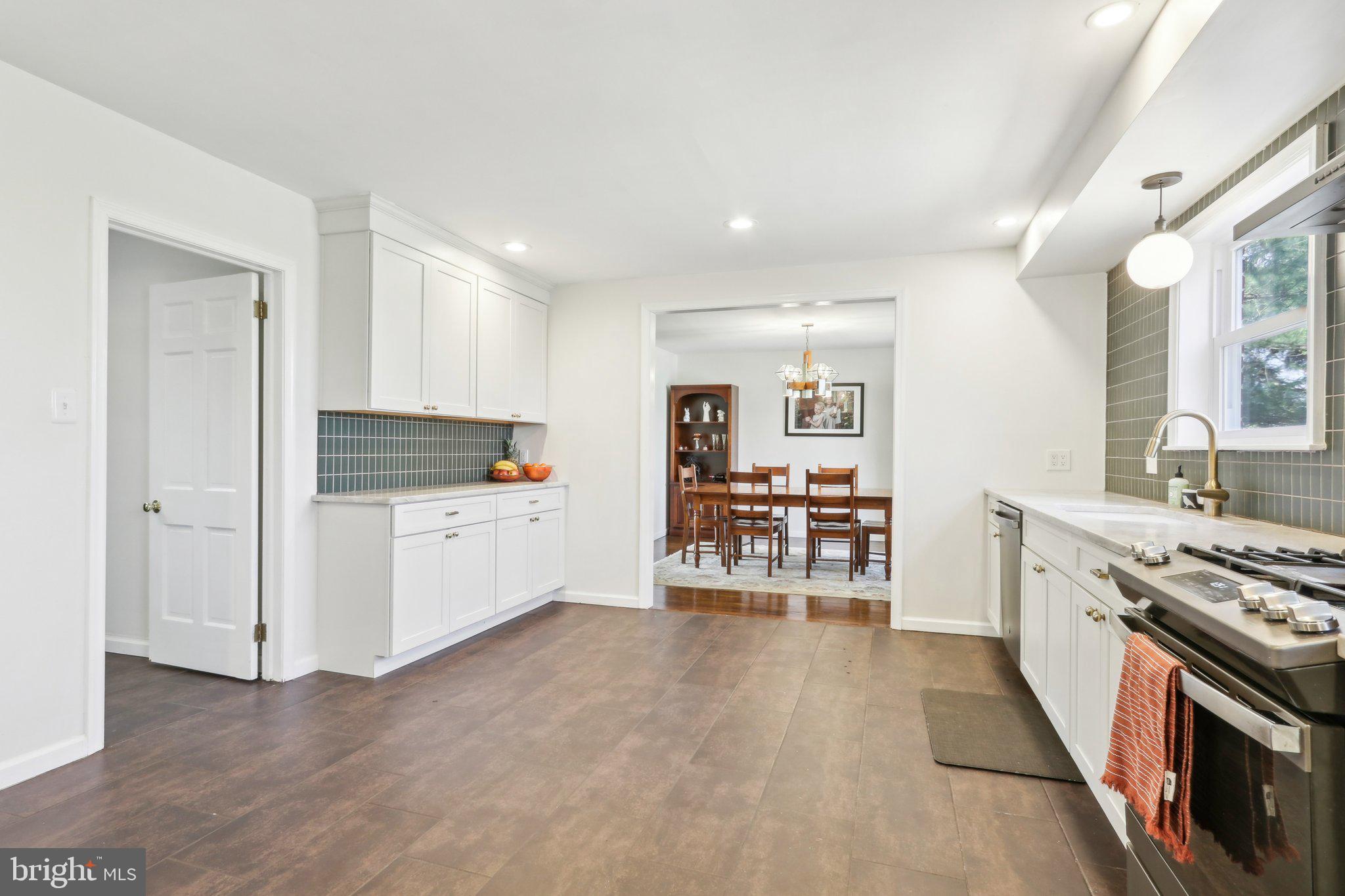 2305 Huntingdon Road Huntingdon Valley, PA 19006 - Photo 8 of 57 a kitchen with stainless steel appliances a stove top oven and a refrigerator