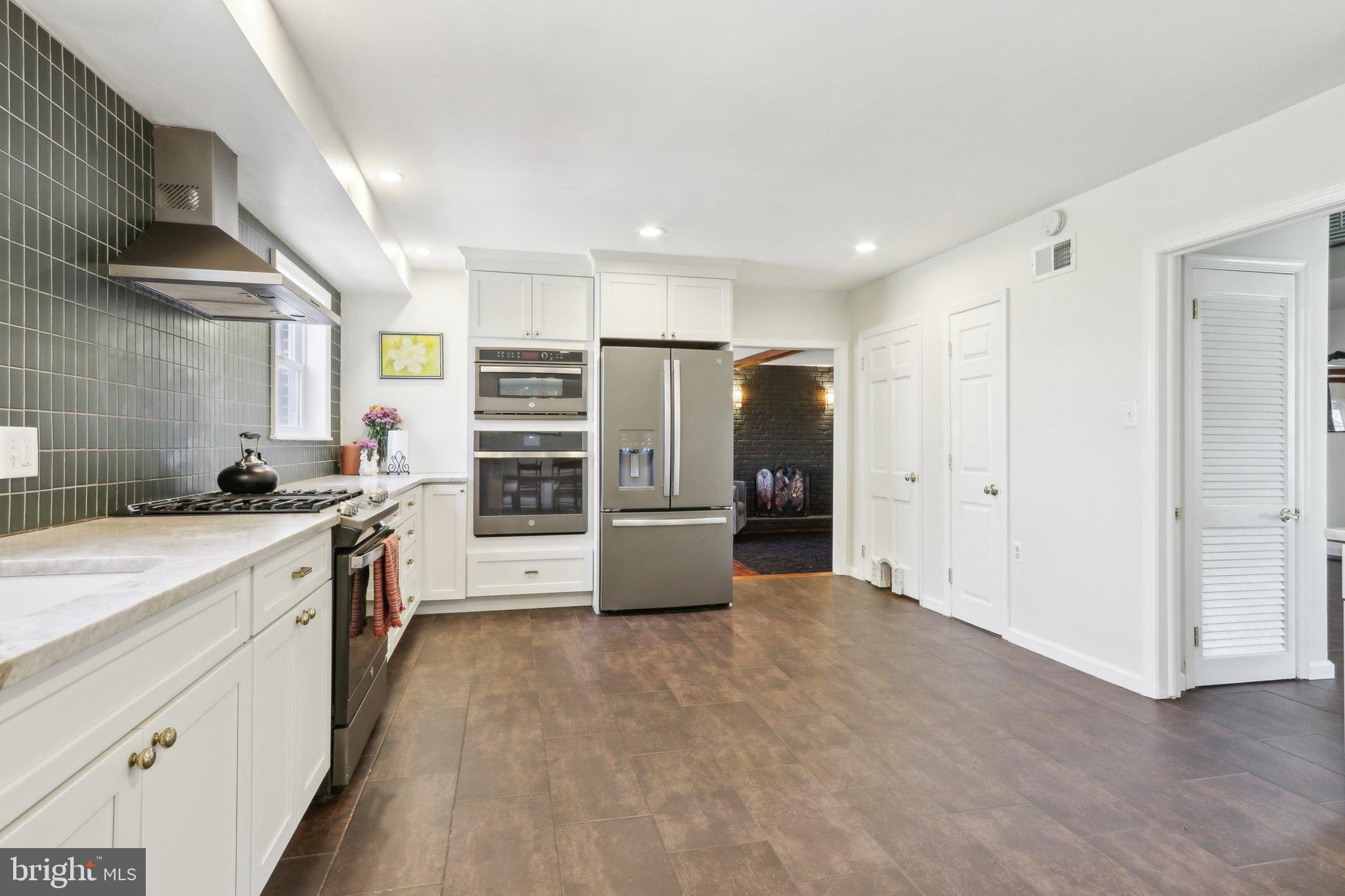 2305 Huntingdon Road Huntingdon Valley, PA 19006 - Photo 9 of 57 a kitchen with stainless steel appliances a refrigerator and a stove top oven