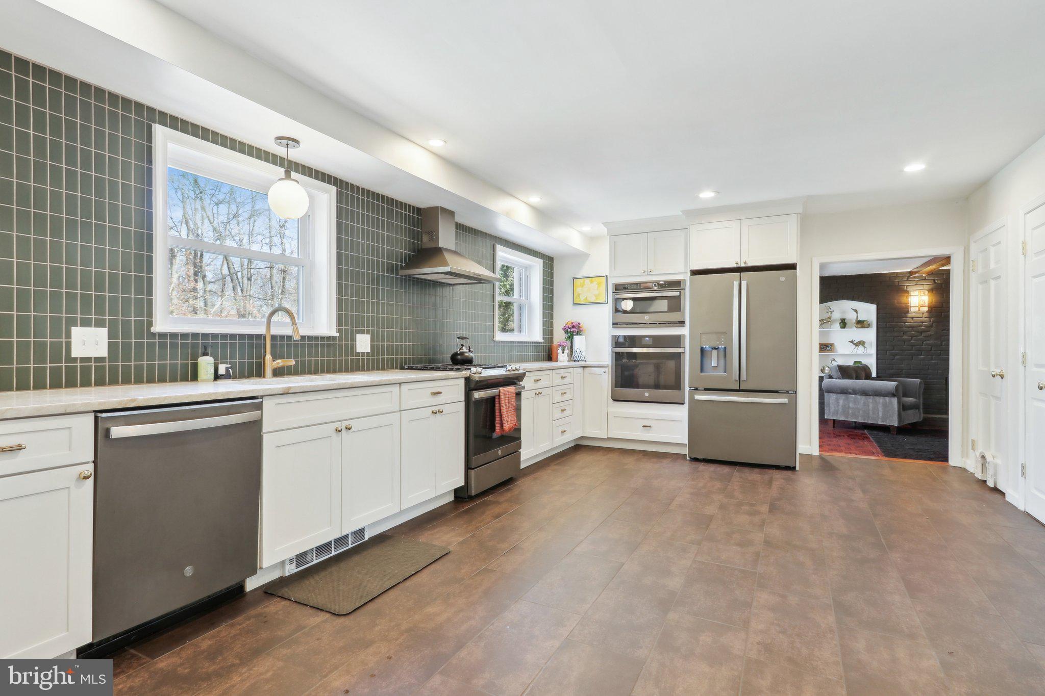 2305 Huntingdon Road Huntingdon Valley, PA 19006 - Photo 10 of 57 a kitchen with a sink stainless steel appliances and cabinets