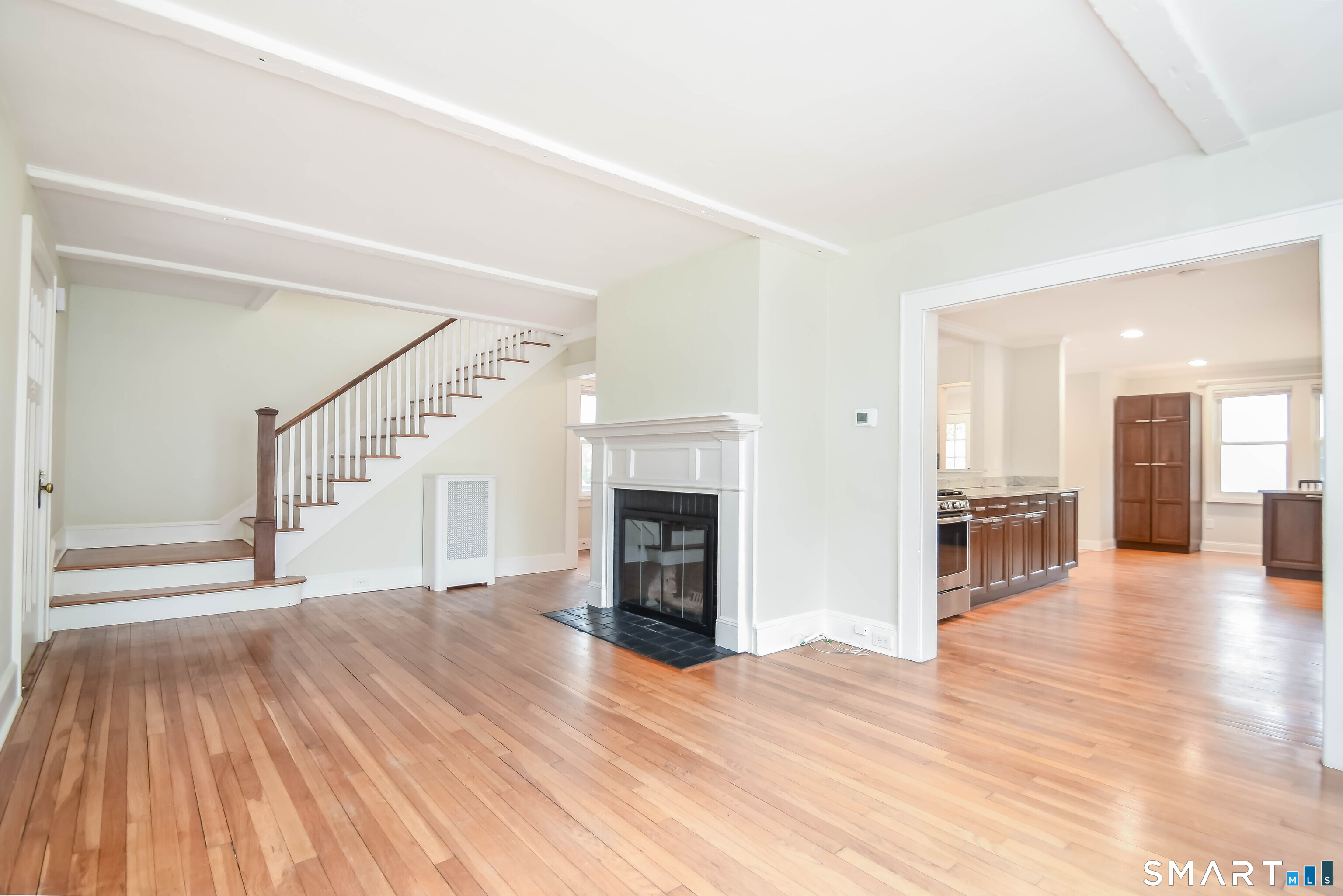 234 North Pine Creek Road Fairfield, CT 06824 - Photo 9 of 28 Living Room with Hardwood Floors and Fireplace
