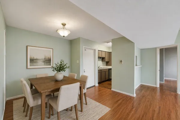 a view of a dining room with furniture and wooden floor