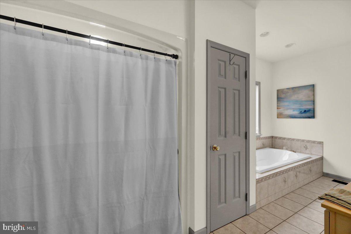 3075 Village Road Orwigsburg, PA 17961 - Photo 19 of 34 Serene bathroom retreat with elegance.