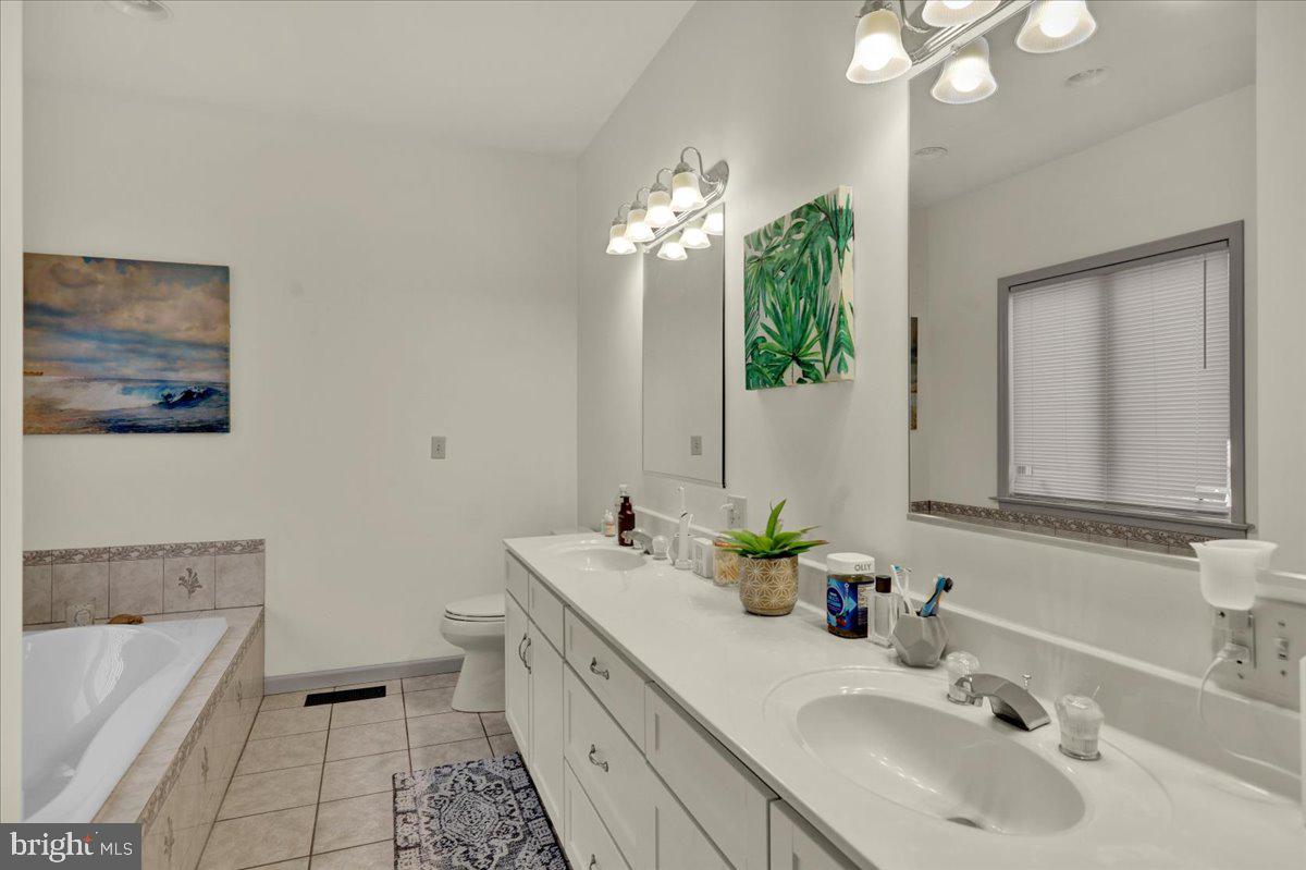 3075 Village Road Orwigsburg, PA 17961 - Photo 20 of 34 Serene bathroom with modern elegance.