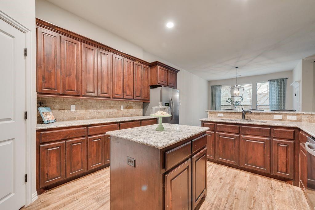 311 Covington Lane Ovilla, TX 75154 - Photo 11 of 29 a kitchen with a sink stove and cabinets