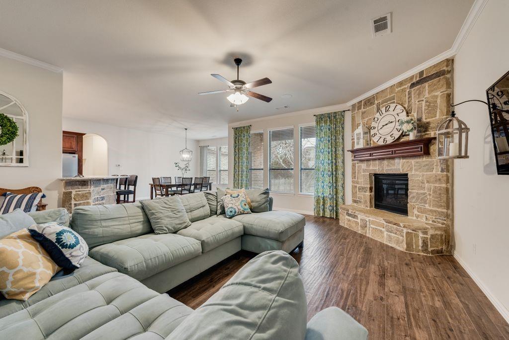 311 Covington Lane Ovilla, TX 75154 - Photo 17 of 29 a living room with furniture a fireplace and a flat screen tv