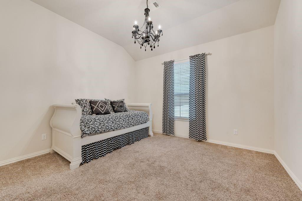 311 Covington Lane Ovilla, TX 75154 - Photo 21 of 29 a living room with furniture and a chandelier