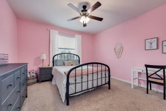 a bedroom with furniture and a chandelier