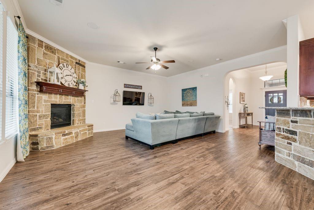 311 Covington Lane Ovilla, TX 75154 - Photo 4 of 29 a living room with furniture wooden floor and a fireplace