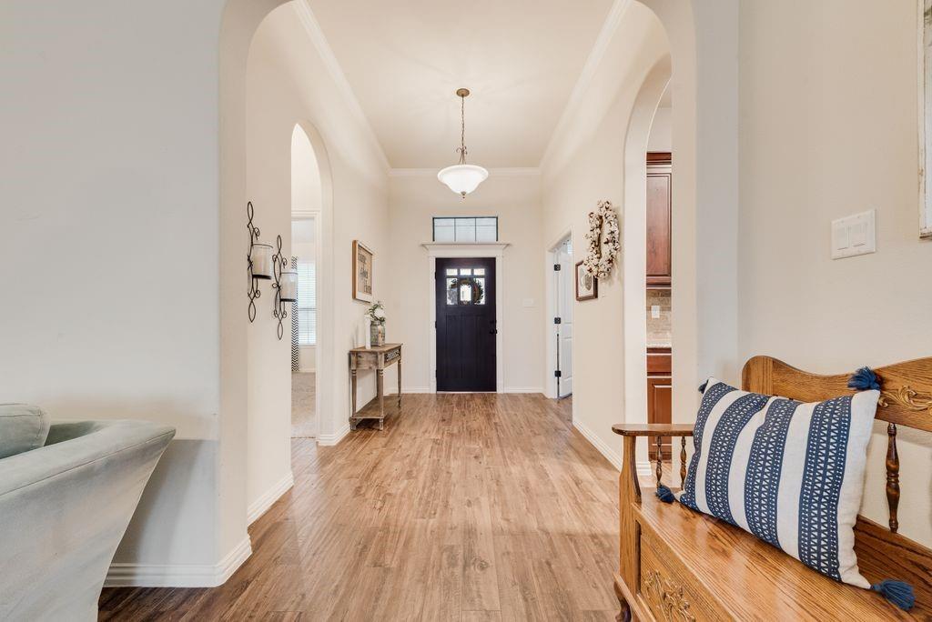 311 Covington Lane Ovilla, TX 75154 - Photo 7 of 29 a view of a bedroom with furniture and wooden floor