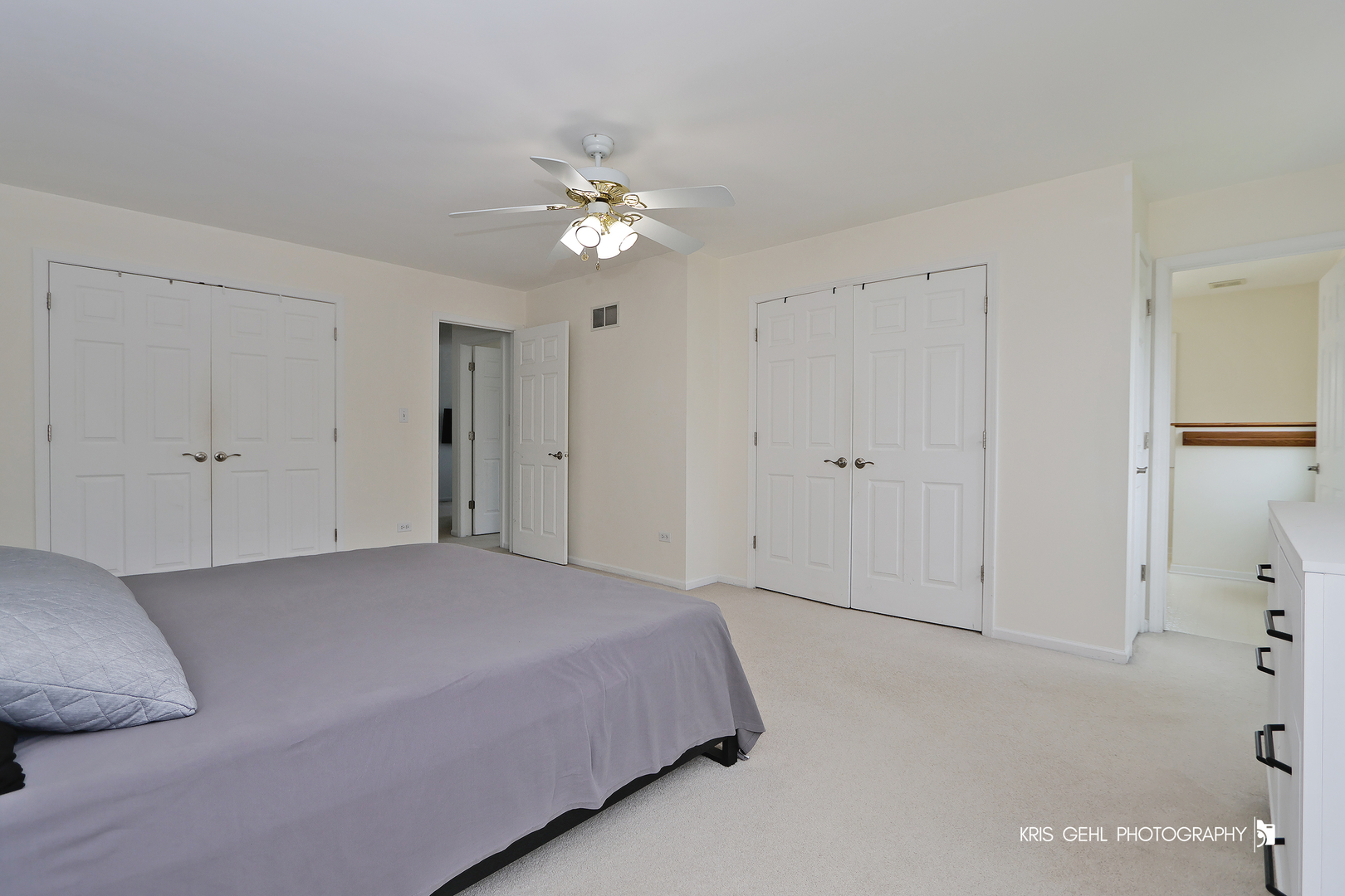 1277 Queen Ann Lane Gurnee, IL 60031 - Photo 13 of 25 a bedroom with a bed and a chandelier