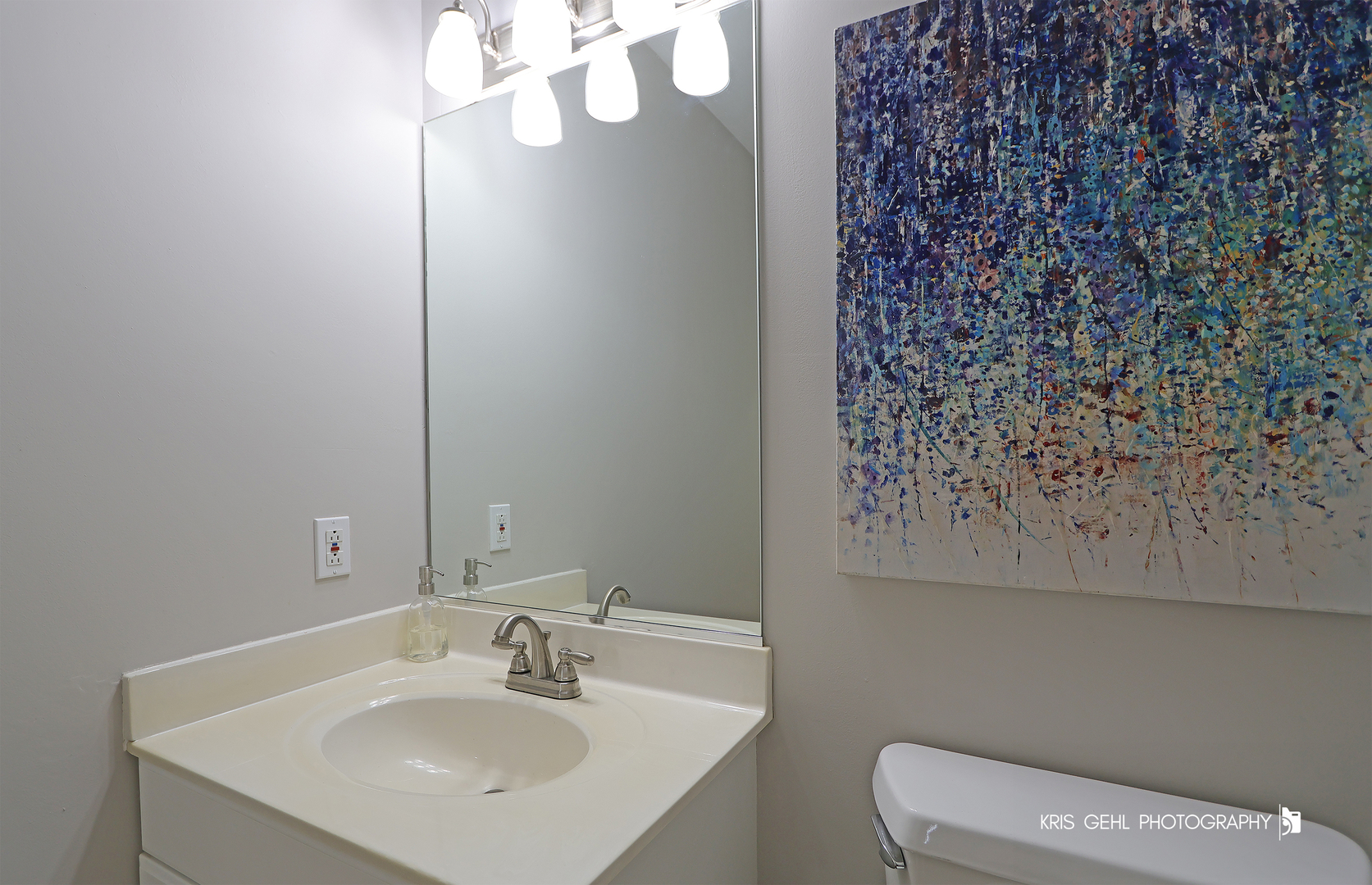 1277 Queen Ann Lane Gurnee, IL 60031 - Photo 17 of 25 a bathroom with a sink a toilet and a mirror