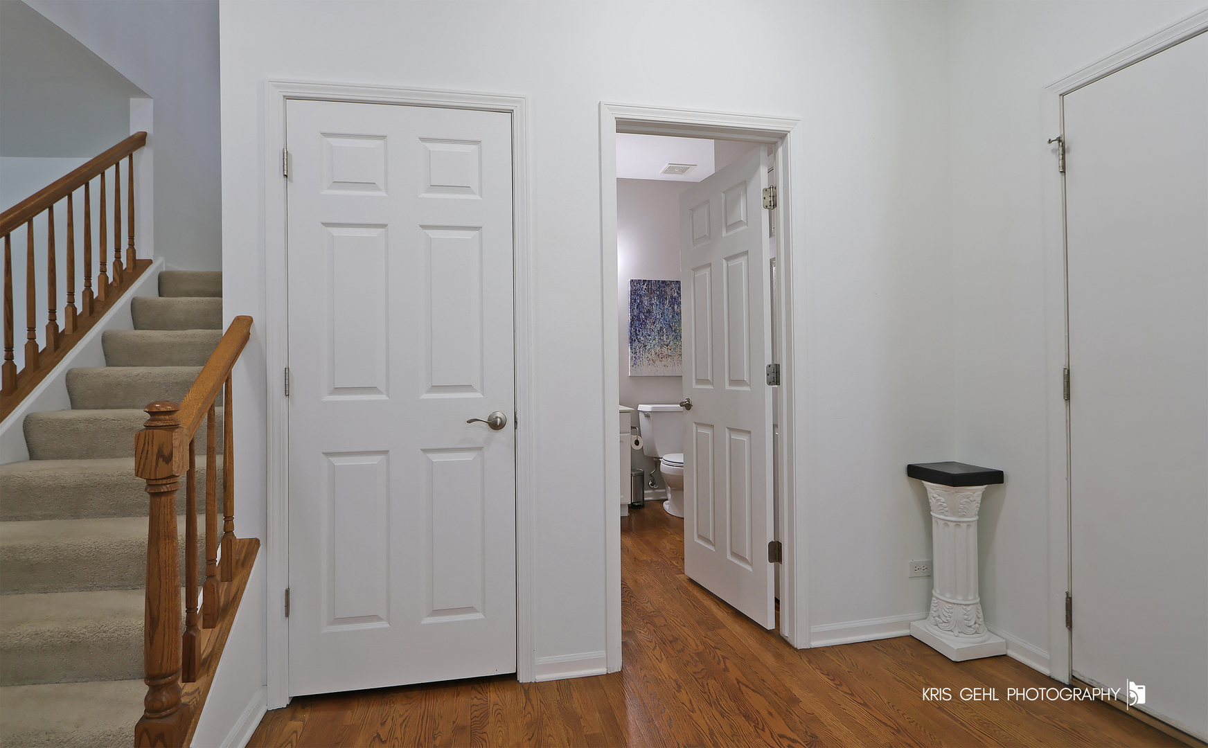 1277 Queen Ann Lane Gurnee, IL 60031 - Photo 2 of 25 a view of a hallway with wooden floor and closet area