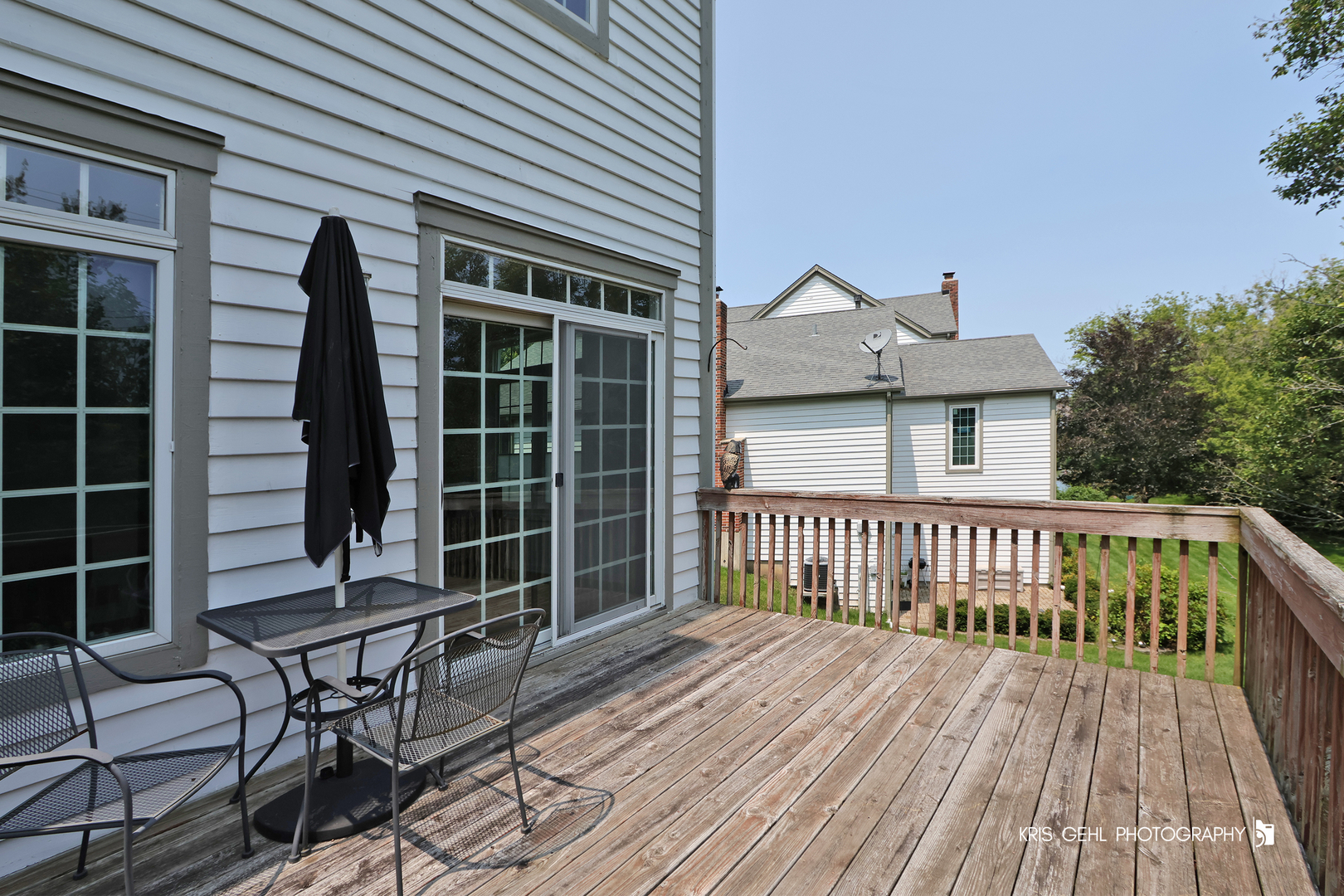 1277 Queen Ann Lane Gurnee, IL 60031 - Photo 21 of 25 a view of a house with a wooden bench