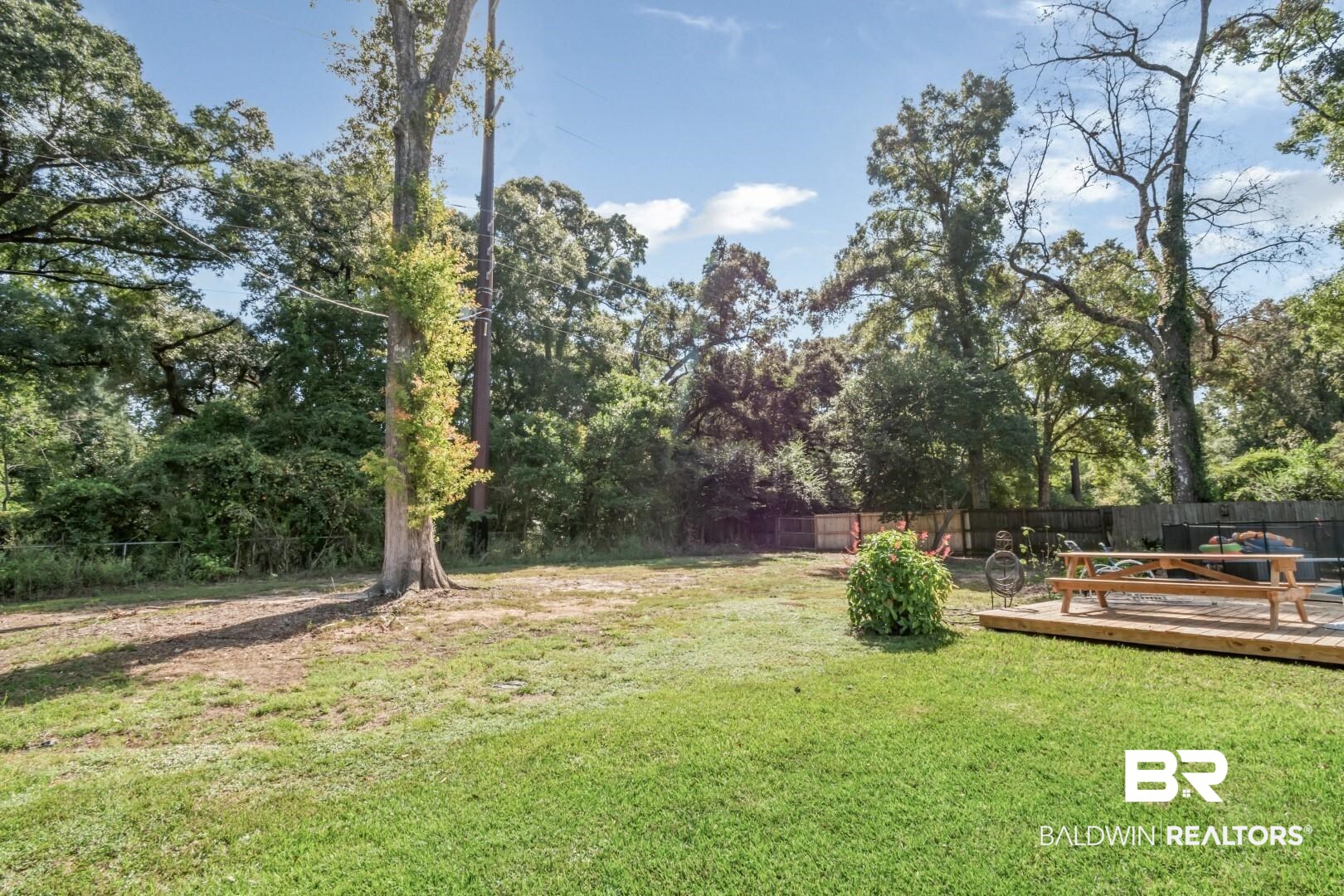 251 Suffolk Road Mobile, AL 36608 - Photo 49 of 53 View of yard with a wooden deck