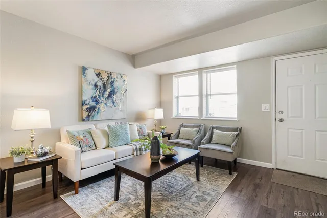 a living room with furniture and a window