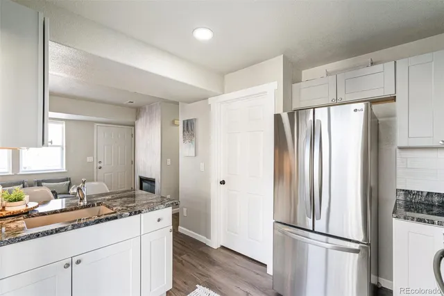 a kitchen with stainless steel appliances a refrigerator and a sink
