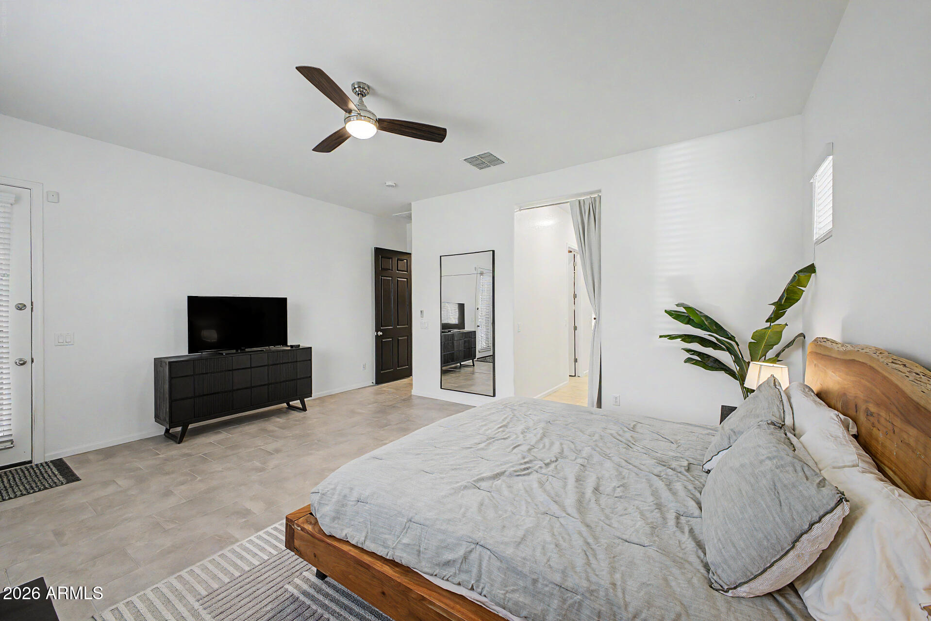 6511 West Steed Ridge Phoenix, AZ 85083 - Photo 5 of 41 a bedroom with a bed and a flat screen tv