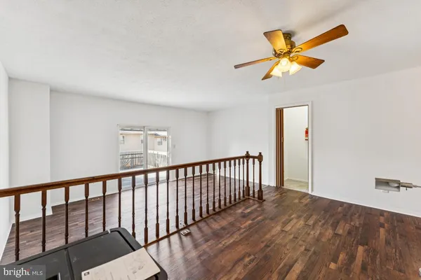 a view of a livingroom with wooden floor