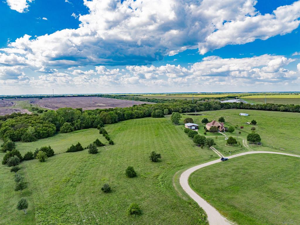 8 Thornhill Road Greenville, TX 75401 - Photo 17 of 17 a view of a golf course with a lake