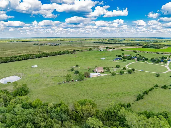a view of a golf course with a yard