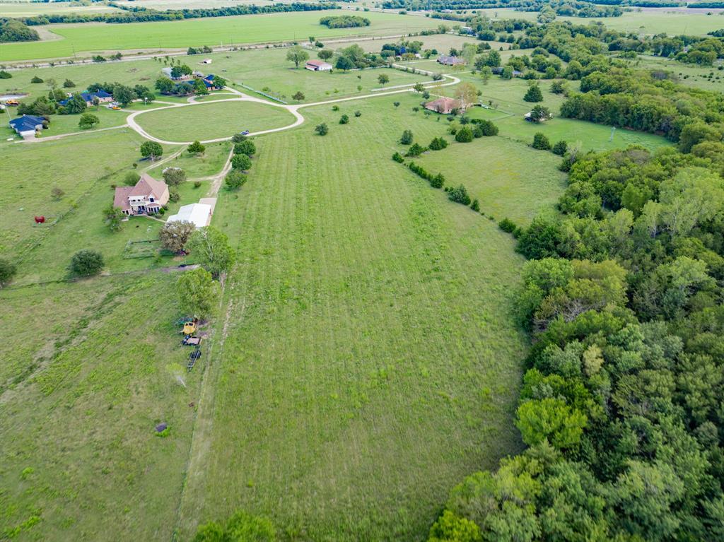 8 Thornhill Road Greenville, TX 75401 - Photo 8 of 17 an aerial view of a residential houses with outdoor space and trees