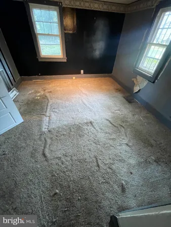 a view of an empty room and window