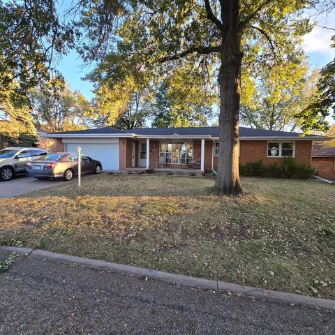a house view with a garden space
