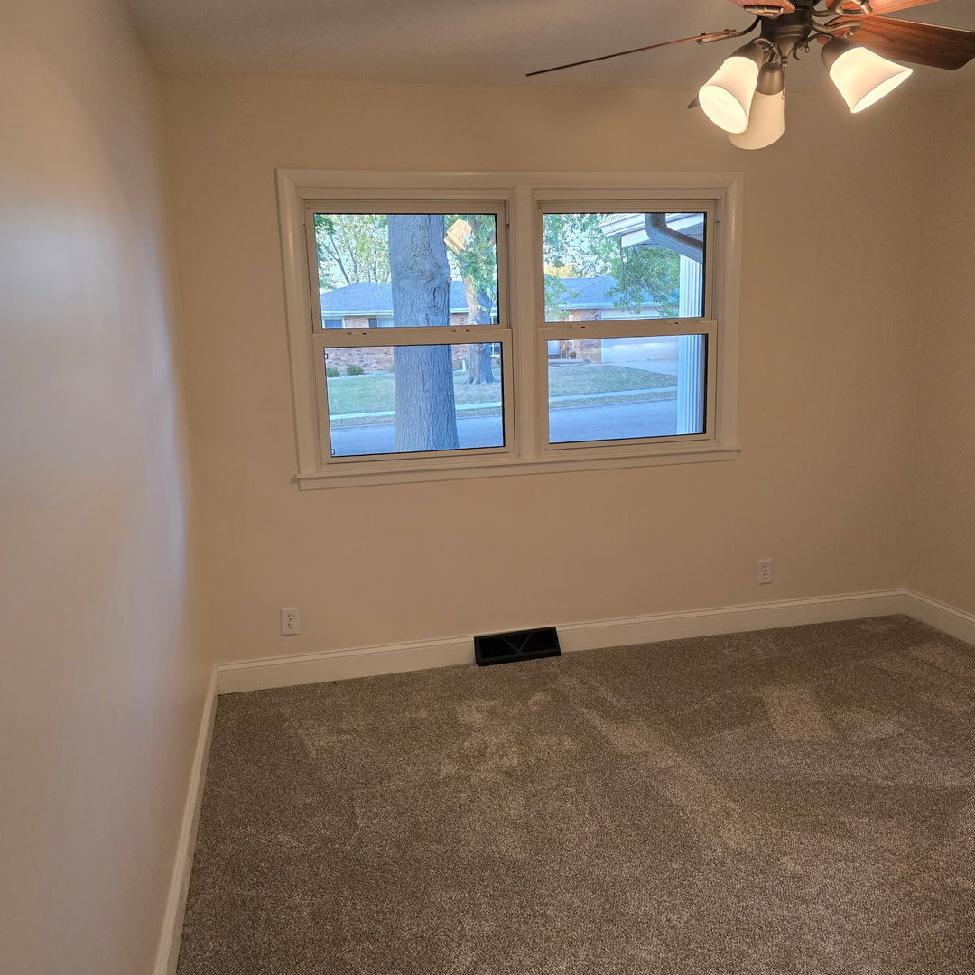 1103 Westview Drive Normal, IL 61761 - Photo 12 of 30 en empty room with windows