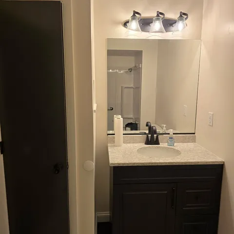 a view of room with window and ceiling fan