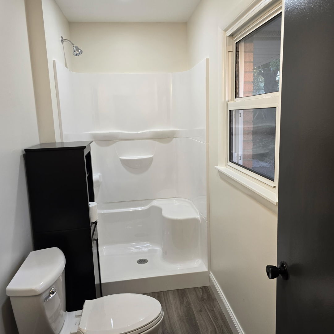 1103 Westview Drive Normal, IL 61761 - Photo 16 of 30 a bathroom with a toilet and a shower
