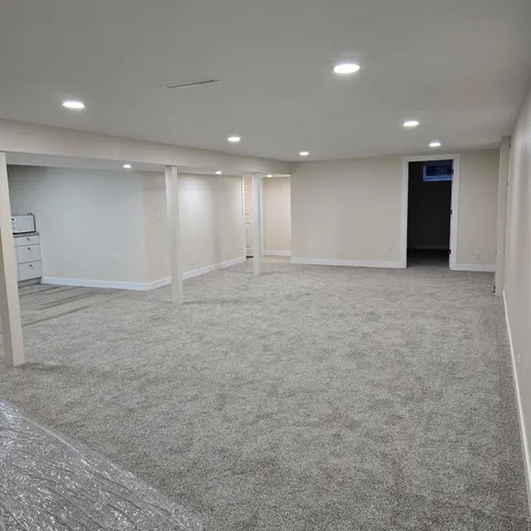 a view of kitchen with cabinets and wooden floor