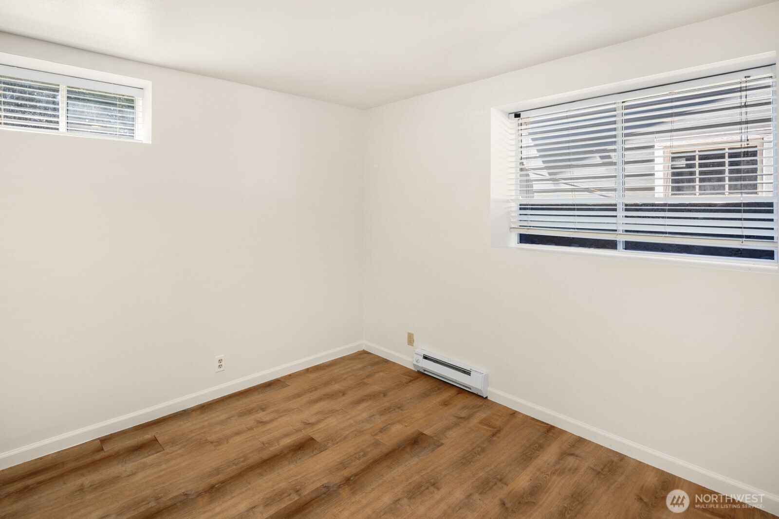 1624 North 50th Street, Unit B Seattle, WA 98103 - Photo 13 of 18 a view of a room with wooden floor and a window