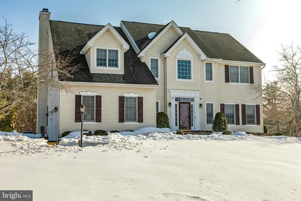 a view of a house with snow on the side of it