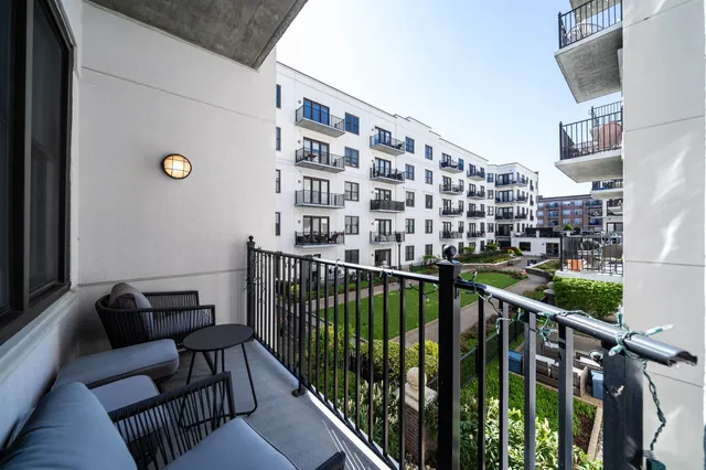 a view of balcony with furniture