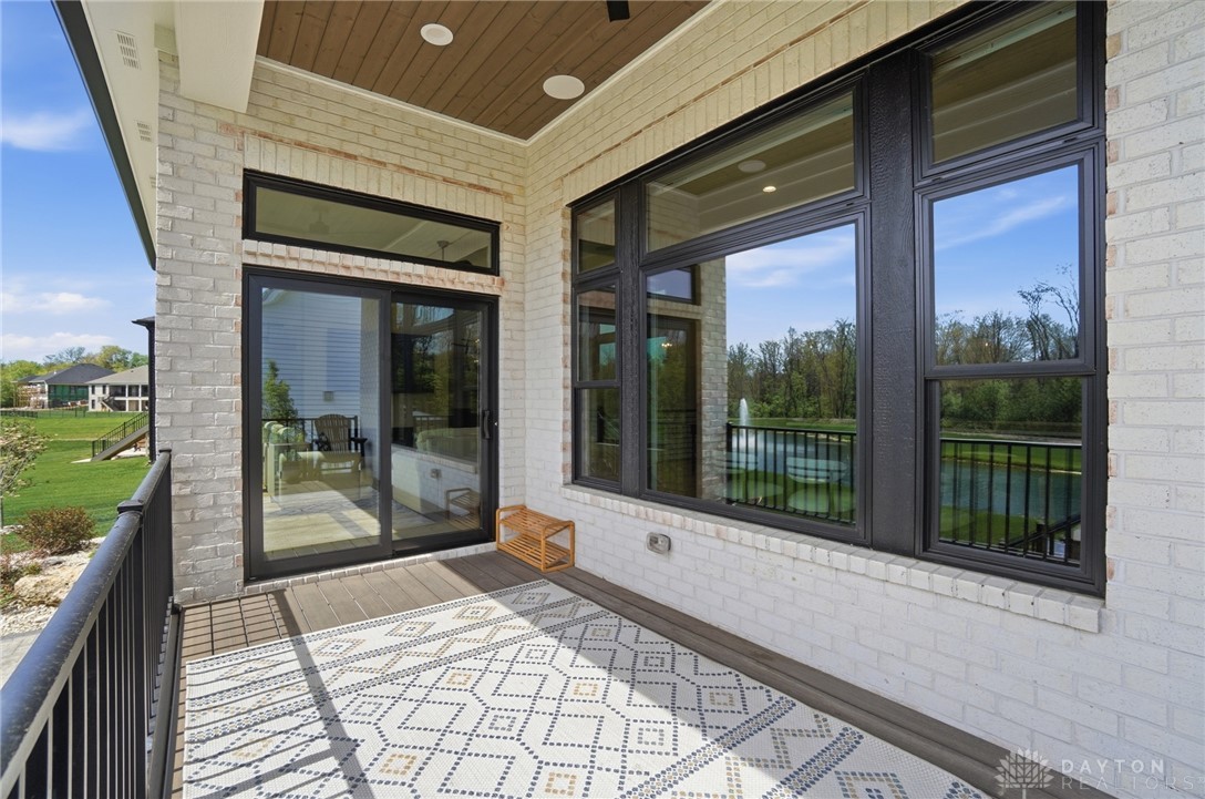 1247 Normandy Rue Dayton, OH 45458 - Photo 64 of 76 This inviting patio offers serene water views, perfect for peaceful mornings or tranquil evenings.